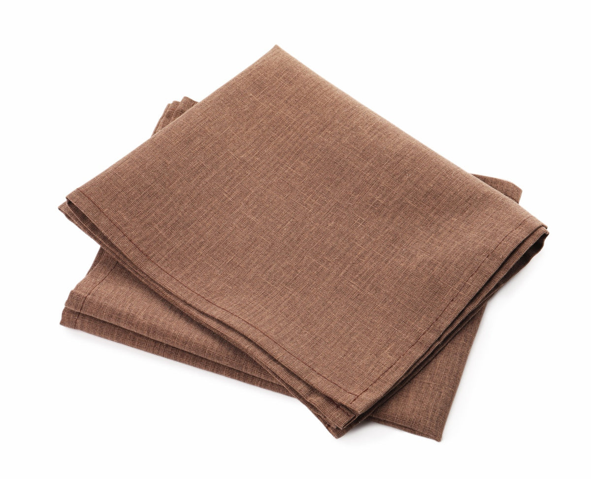 Folded brown linen napkins on a pure-white background