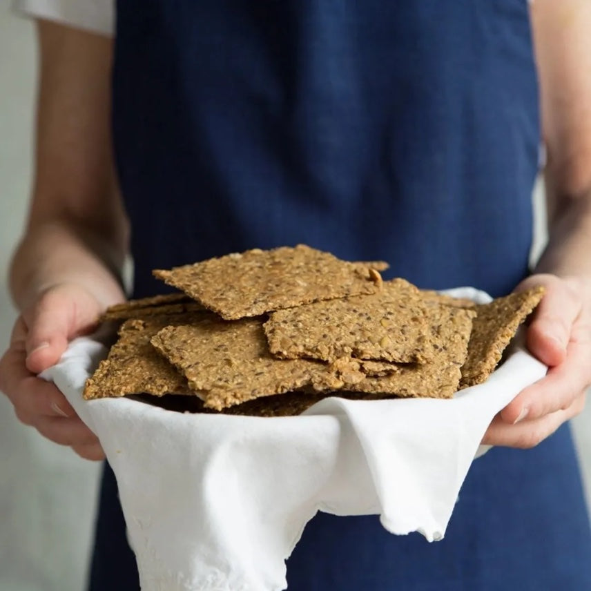 Hands holding organic Nordic knekkebrød crispbreads