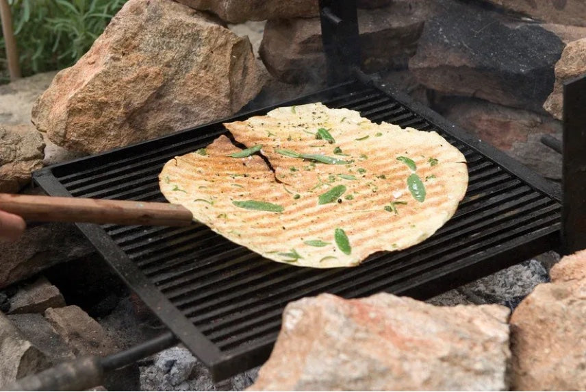 Pane Rustico flatbread grilling over fire