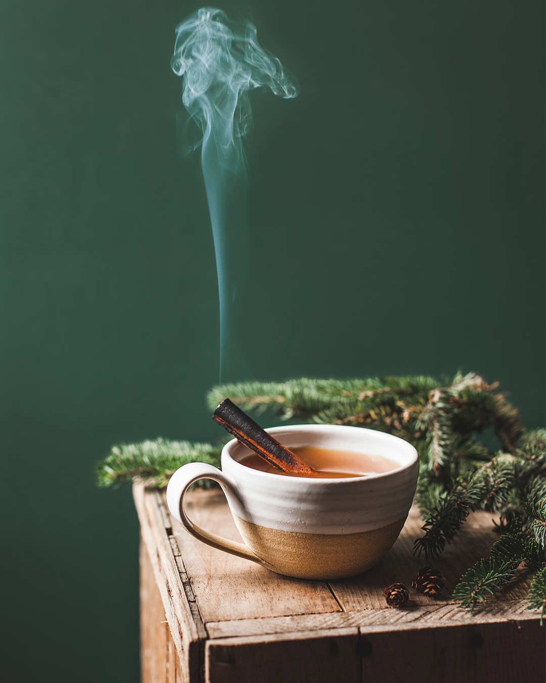 Farmhouse Pottery Pantry Mug with a warm cinnamon drink on a wooden crate