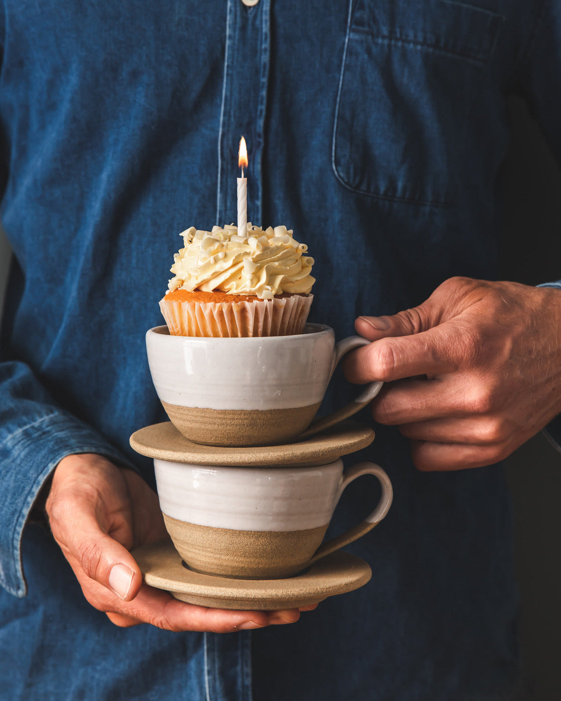 Farmhouse Pottery Pantry Mugs styled with a cupcake and saucers; saucers not included