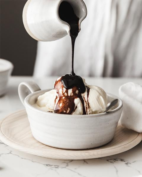 Vanilla ice cream with chocolate sauce served in the white Silo Soup Mug