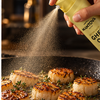 Mantova Butter Taste Ghee Oil Spray misting scallops in a skillet